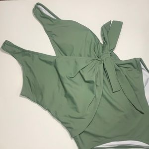 Green one piece bathing suit with bow tie size medium